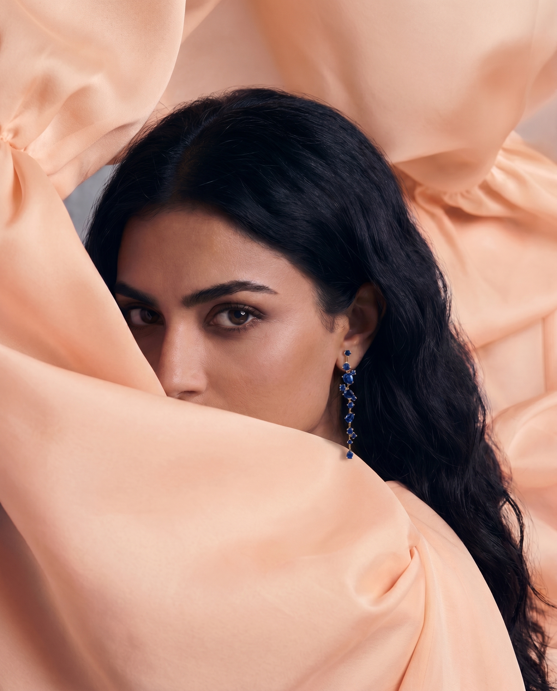 woman wearing ruby and diamond earrings 
