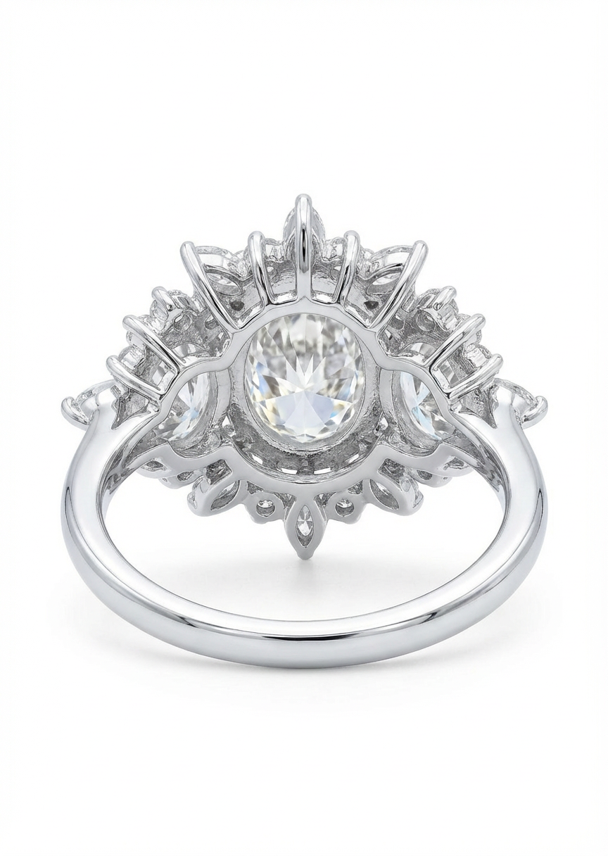 Diamond ring with a central gemstone and surrounding diamonds on a white background