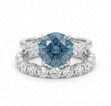 Blue diamond ring with a full eternity diamond band on a white background