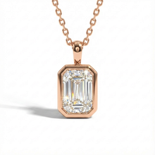 Rose gold necklace with a diamond pendant on a white background