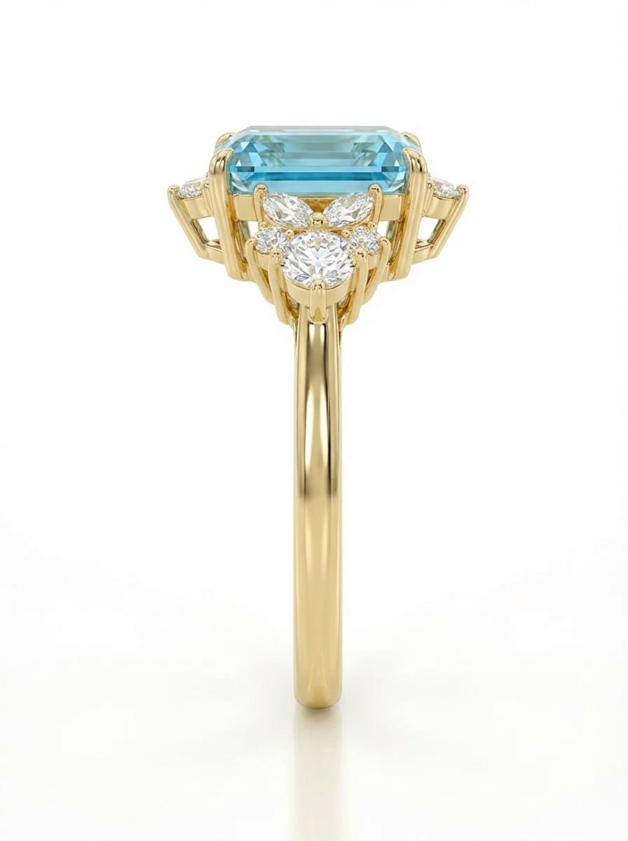 Gold ring with a blue gemstone and diamond on a white background