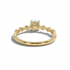 Gold ring with a diamond on a white background