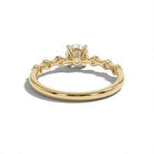Gold ring with a diamond on a white background