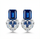 Pair of blue gemstone earrings with a diamonds on a white background