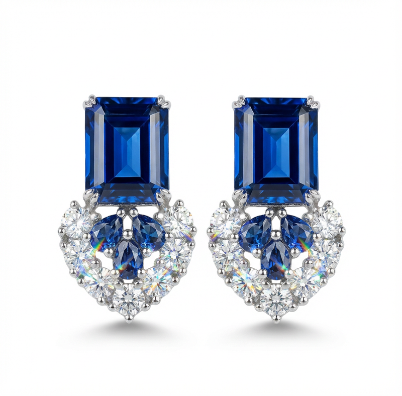 Pair of blue gemstone earrings with a diamonds on a white background