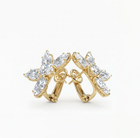diamond floral Gold hoop earrings with clear gemstones on a white background