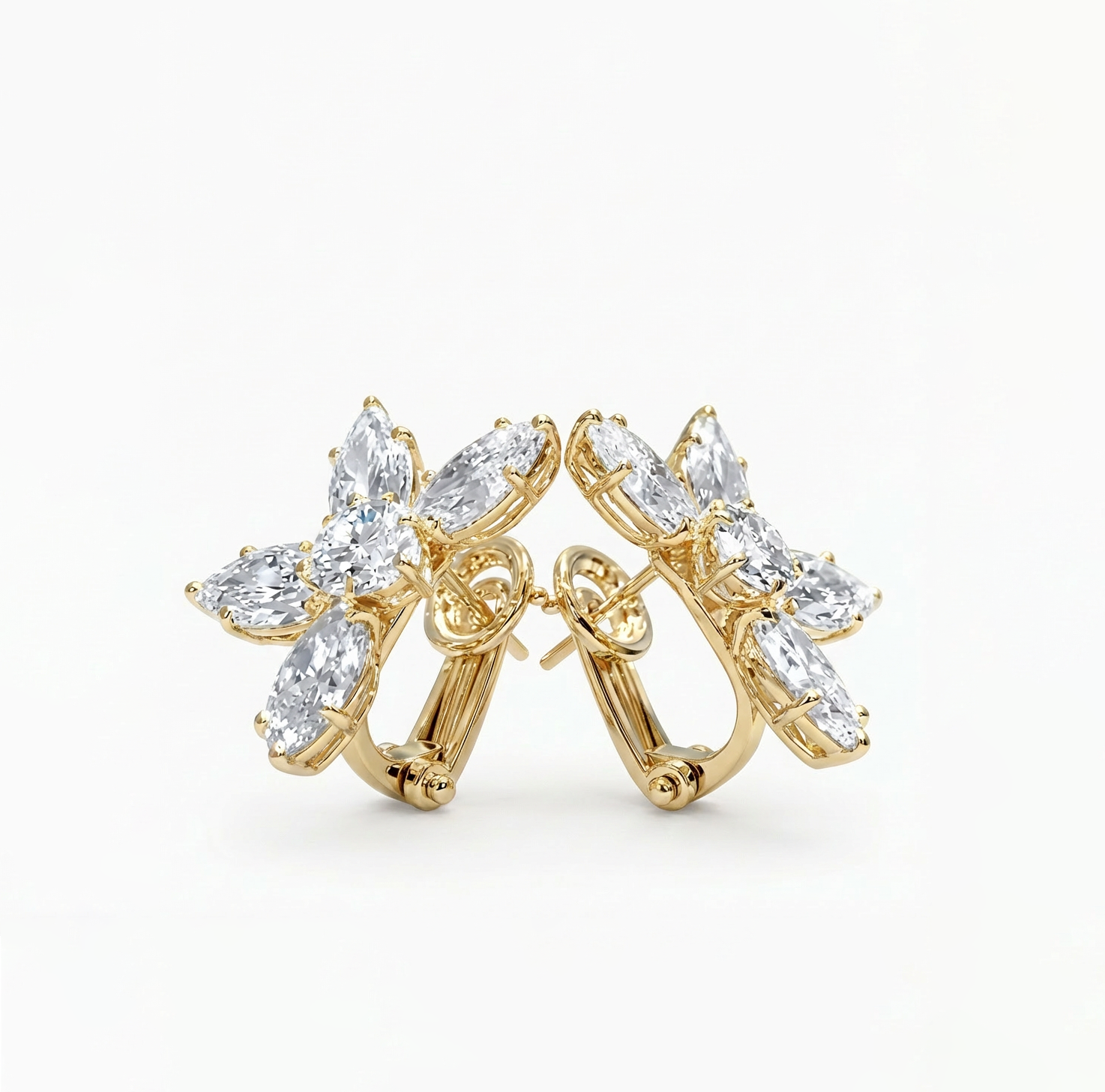 diamond floral Gold hoop earrings with clear gemstones on a white background