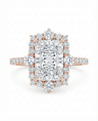 Rose gold diamond ring with a large central radiant cut diamond with a diamond halo 