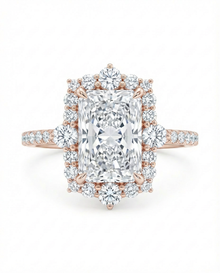 Rose gold diamond ring with a large central radiant cut diamond with a diamond halo 
