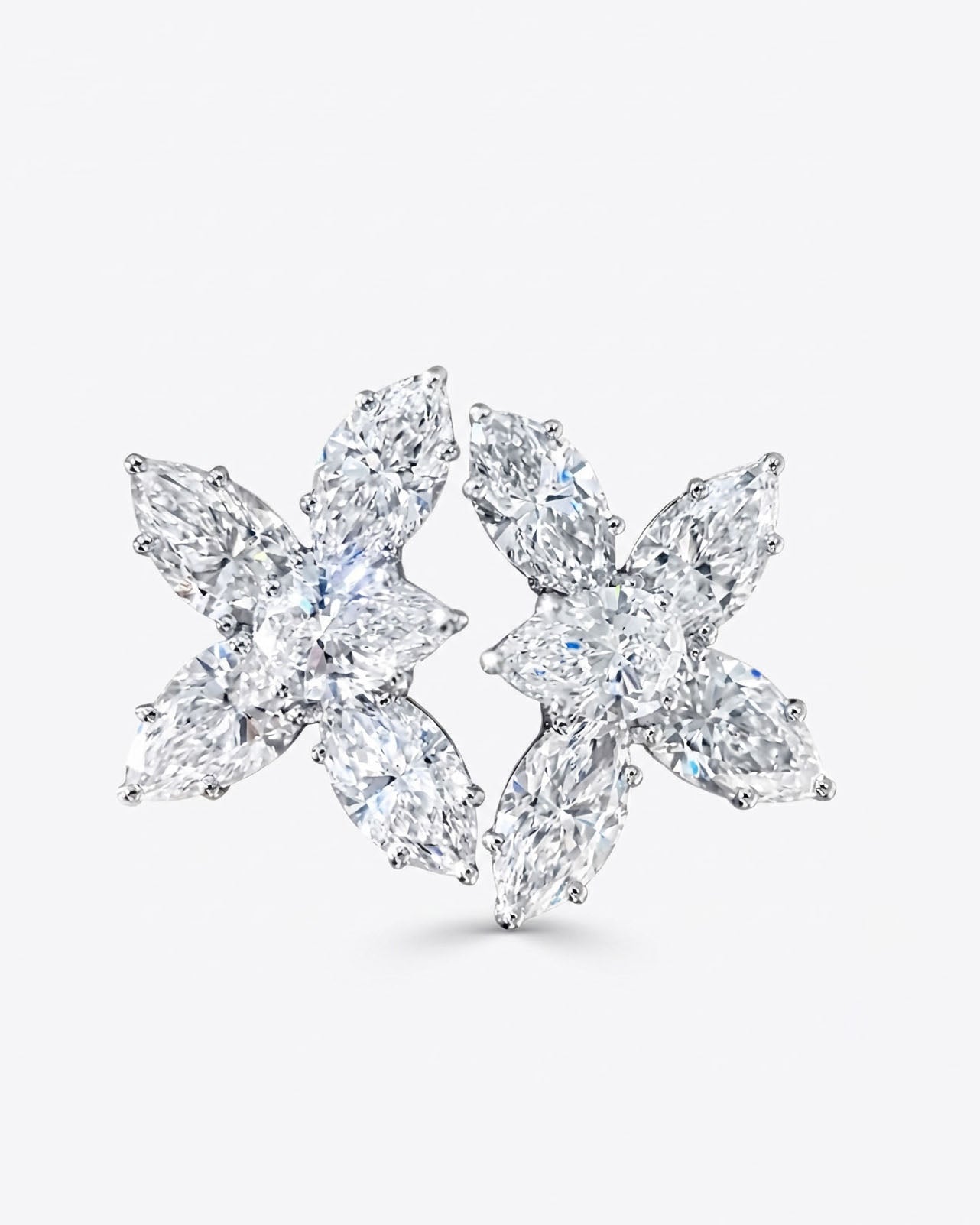 Pair of diamond earrings on a white background