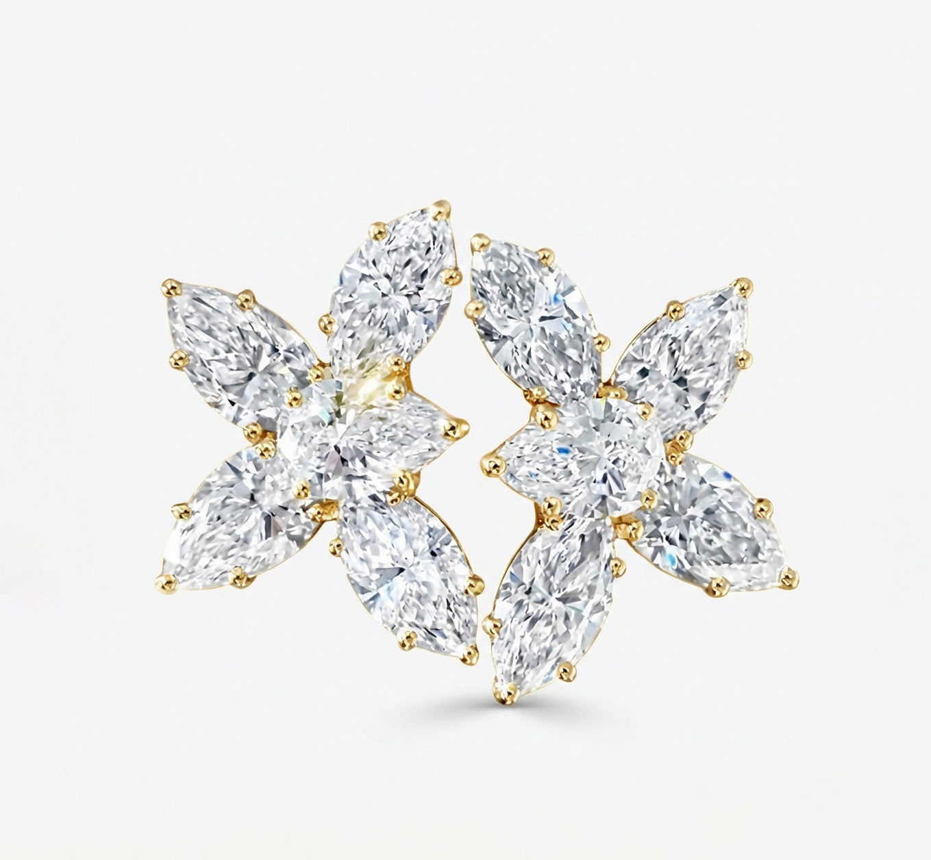 Pair of diamond earrings on a light gray background