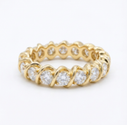 Gold ring with diamonds on a white background