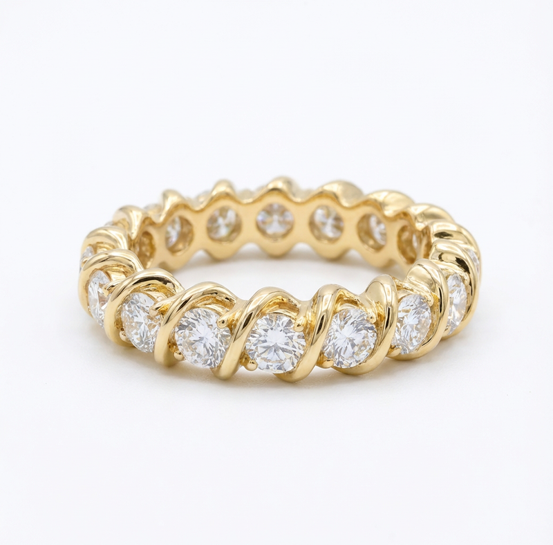 Gold ring with diamonds on a white background