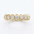 Gold ring with diamonds on a white background