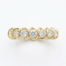 Gold ring with diamonds on a white background
