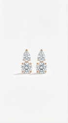 Pair of diamond earrings on a light gray background