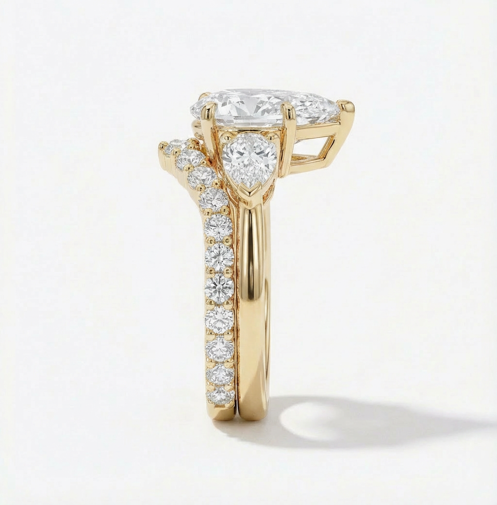 Gold ring with diamond accents on a light gray background