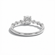 Silver ring with a diamond on a white background