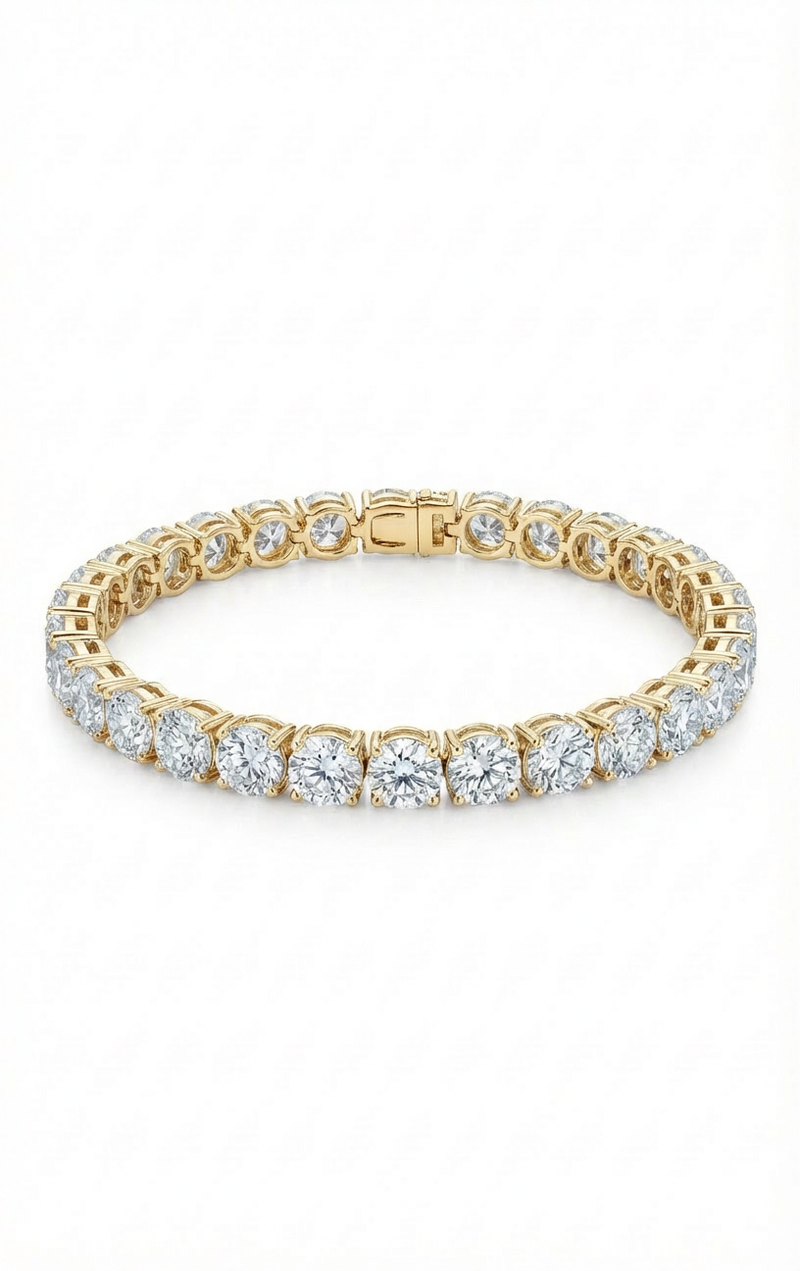 Gold bracelet with clear gemstones on a white background