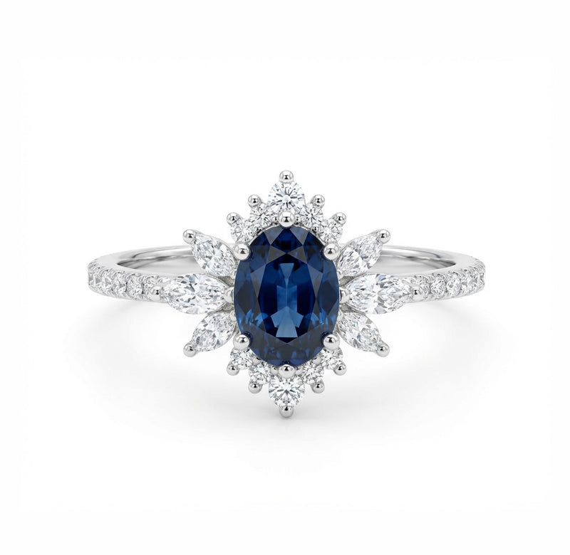 Elegant ring with a blue gemstone and diamond accents on a white background