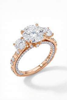 Rose gold ring with a large diamond and smaller diamonds on a white background