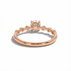 Rose gold ring with a diamond on a white background