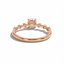 Rose gold ring with a diamond on a white background