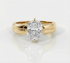 Gold ring with a large diamond on a white background