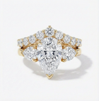 Gold and diamond ring on a white background