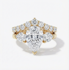 Gold and diamond ring on a white background