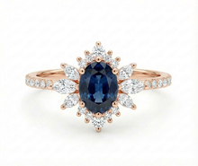Rose gold ring with a blue gemstone and diamond accents on a white background