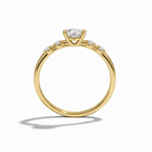 Gold ring with a diamond on a white background