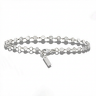 Silver bracelet with small round beads on a white background
