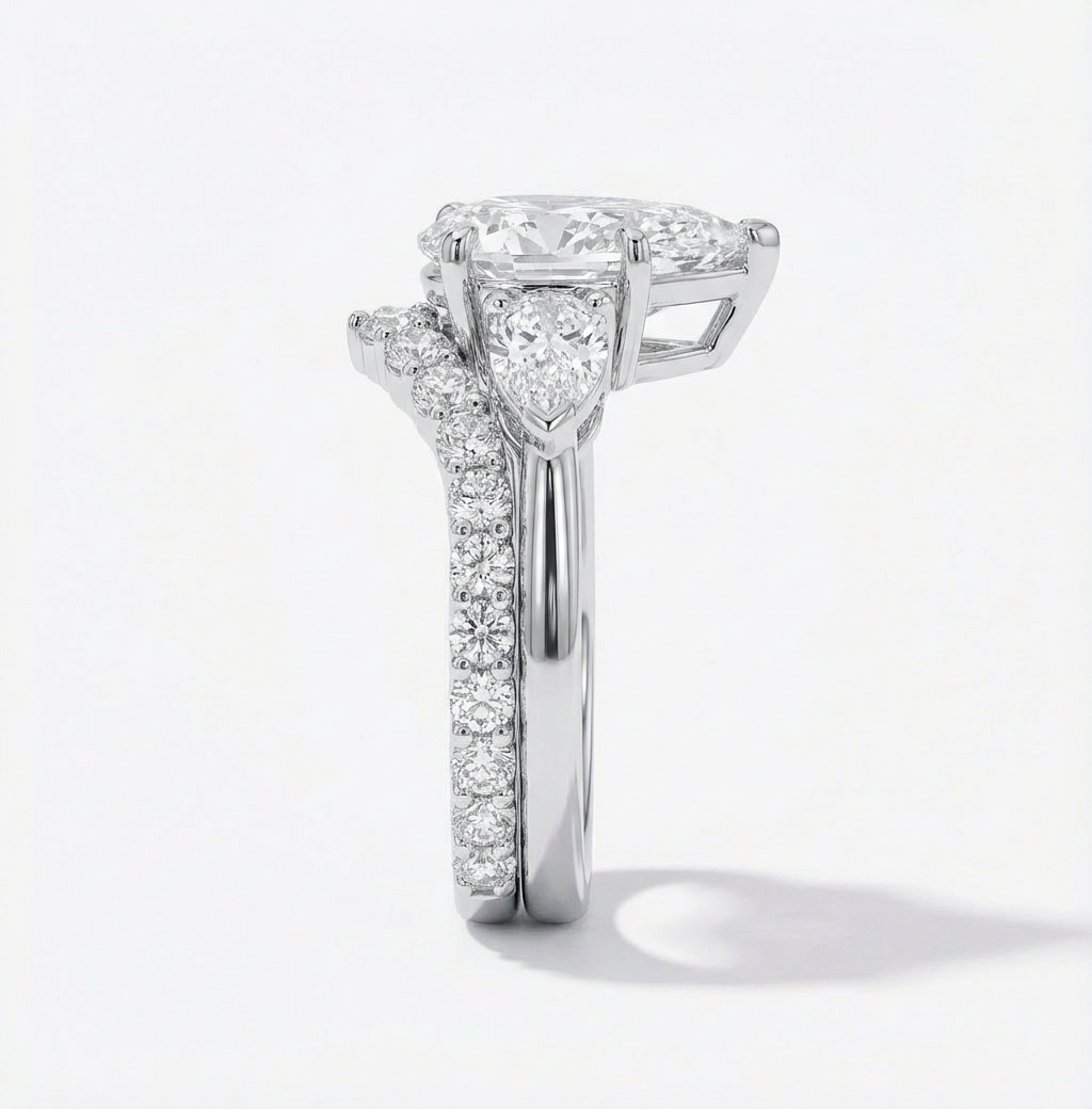 Diamond ring with a heart-shaped center stone on a white background