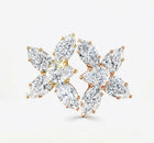 Pair of floral diamond earrings on a white background