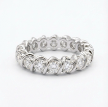 white gold full eternity diamond wedding band on a white background