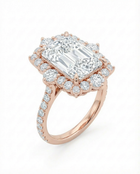 yellow gold diamond ring with a large central radiant cut diamond with a diamond halo 