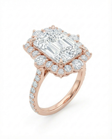 yellow gold diamond ring with a large central radiant cut diamond with a diamond halo 