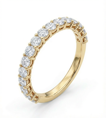 Gold wedding band rwith diamonds on a white background