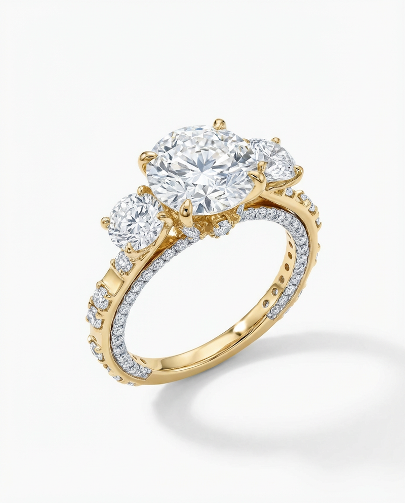 Gold ring with three diamonds on a white background